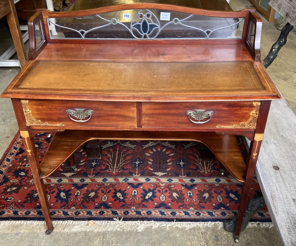 An Edwardian inlaid mahogany side table, the superstructure with an inset stained glass panel, width 95cm, depth 50cm, height 91cm
